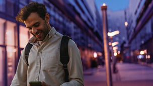 Men on the street with cellphone