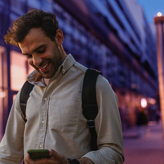Men on the street with cellphone