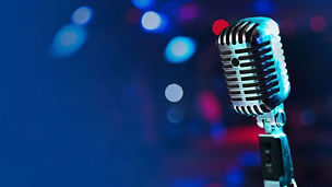 A close up shot of a microphone with a dark background