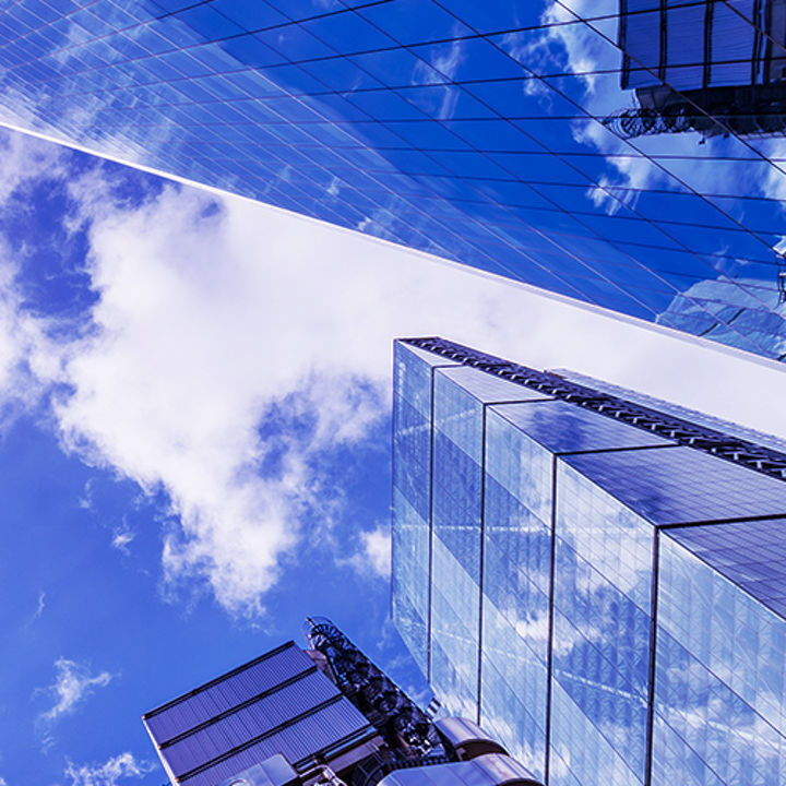 Glass façade and clouds