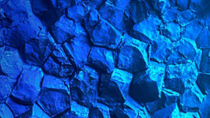 Blue rock wall inside cave