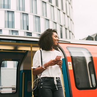 Young woman steps off metro