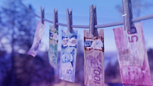 Canadian dollar bills on a clothesline money laundering