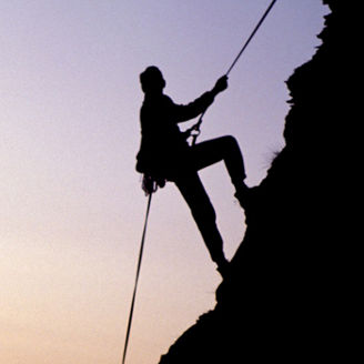 Mountain climber in the evening