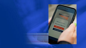 A hand holding a mobile phone