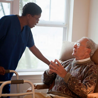 nurse attending an old man