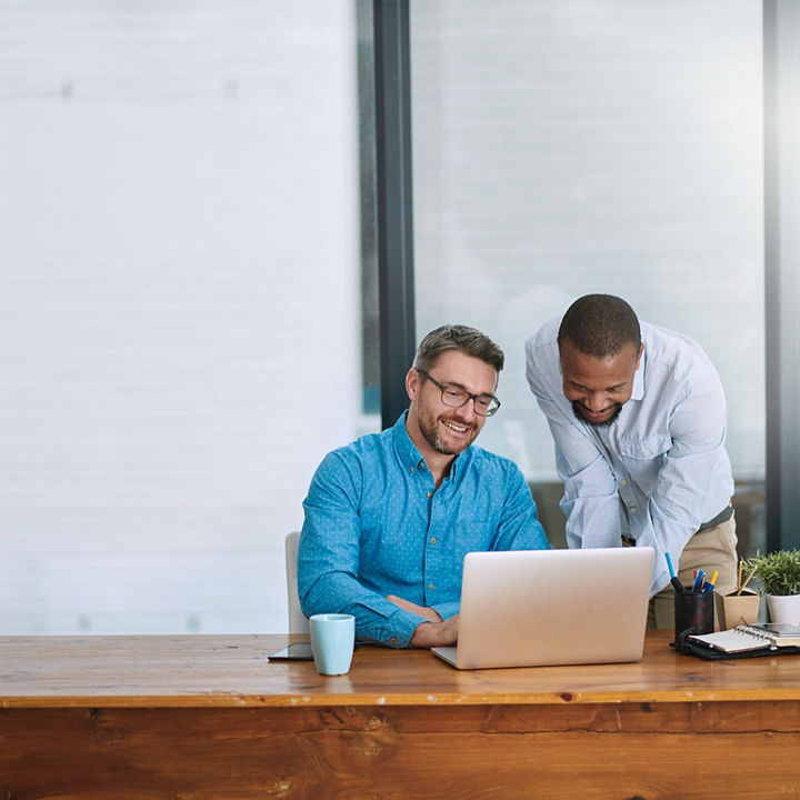 Office teamwork on laptop banner