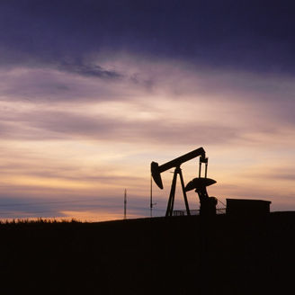 Oil drill at sunset