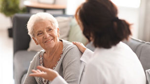 Old age women looking at doctor banner