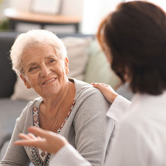 Old age women looking at doctor banner