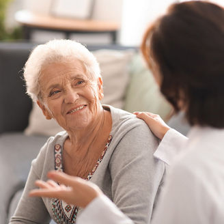 Old age women looking at doctor