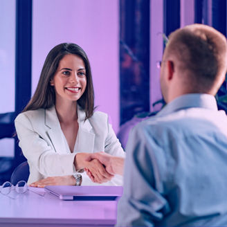 Girl smiling in a group meeting