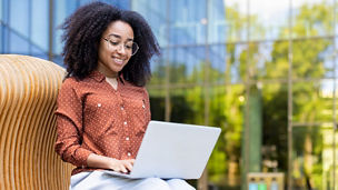 Colleague working on her laptop outside