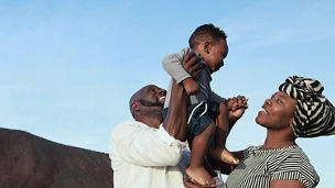 Parents holding child