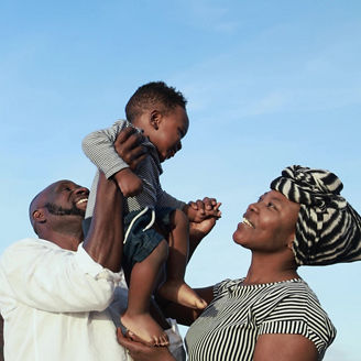 Parents Holding Child