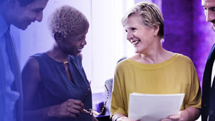Woman laughing in a meeting