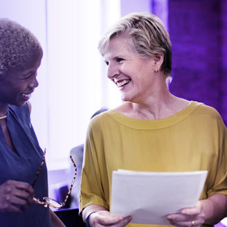 Woman laughing in a meeting