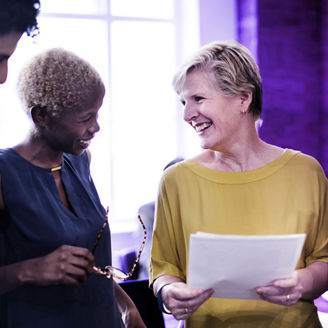 woman laughing in a meeting