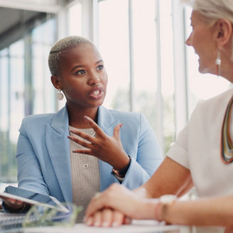 People sat at a table in discussion