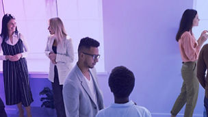 People in a room having a discussion banner