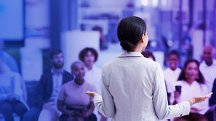woman standing before a group