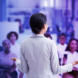 woman standing before a group