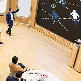 people sitting on round table for presentation