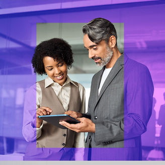 Two colleagues discussing something with tablet in their hands