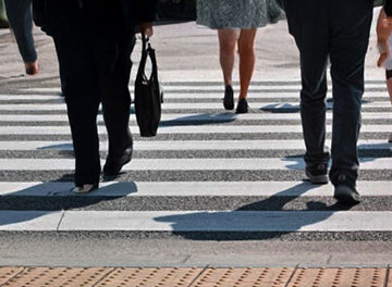 People walking across a crosswalk