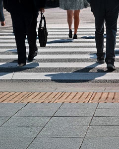 People walking across a crosswalk