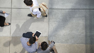 People walking and talking on a side path