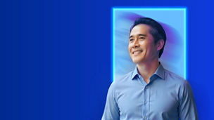 A portrait of a person in a glowing frame against a blue background.