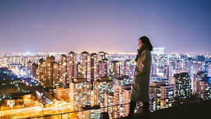 Person looking city nightlights