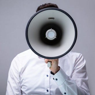 Person behind megaphone