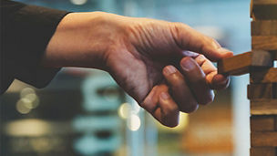 Person playing Jenga