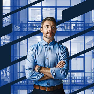 Person standing in front of modern office building banner