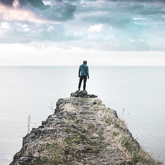 Person standing on the edge of the cliff