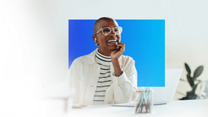 Blue and purple balloons amongst a cloud