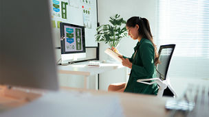 Businesswoman planning sustainable strategy at modern office