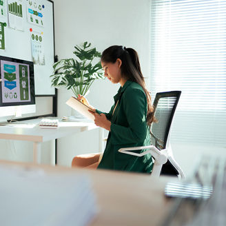 Businesswoman planning sustainable strategy at modern office