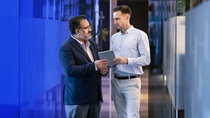 two men talking in the office