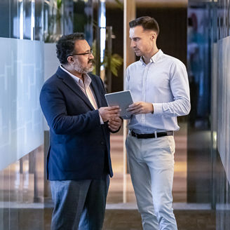 two men talking in the office