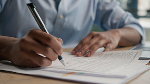 A man doing a test on a piece of paper