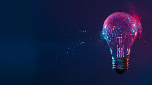 Rozbita żarówka na abstrakcyjnym tle