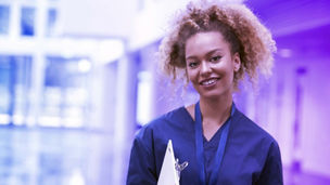 Portrait of female nurse wearing scrubs in hospital