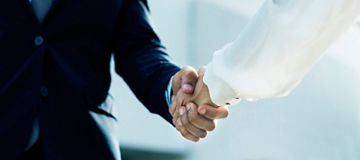 Professional corporate businesspeople shaking hands