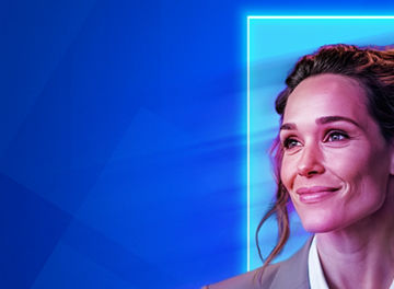 Professional portrait against a blue background