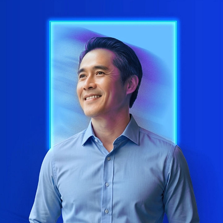 Professional portrait against a digital themed background.