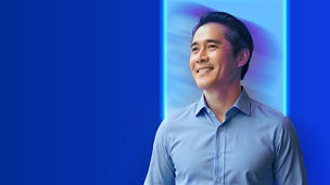 Professional portrait against a digital themed background