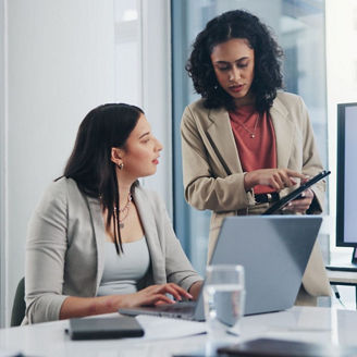 Professionals analyzing business performance dashboards and reports